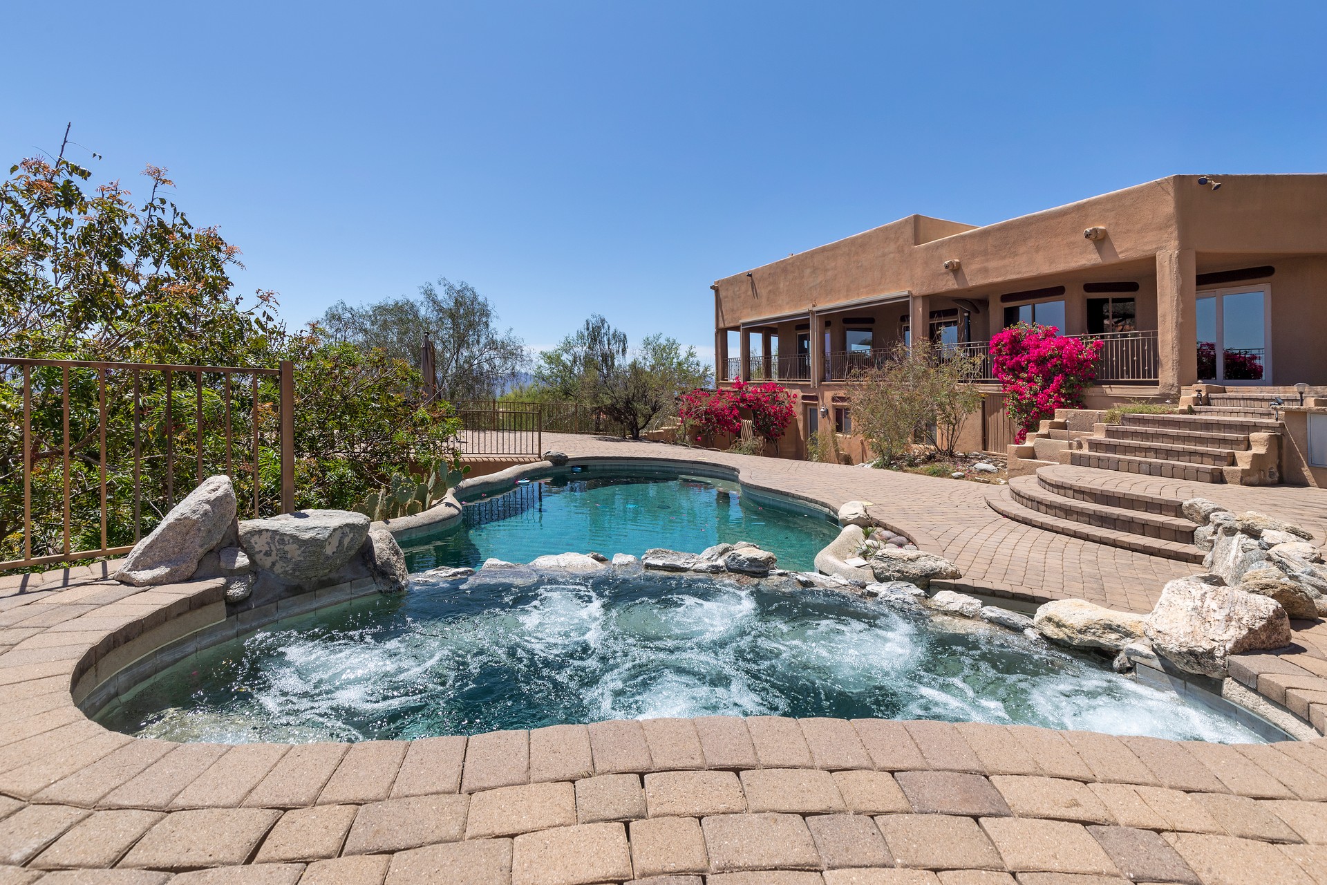 Swimming pool with terraced patio