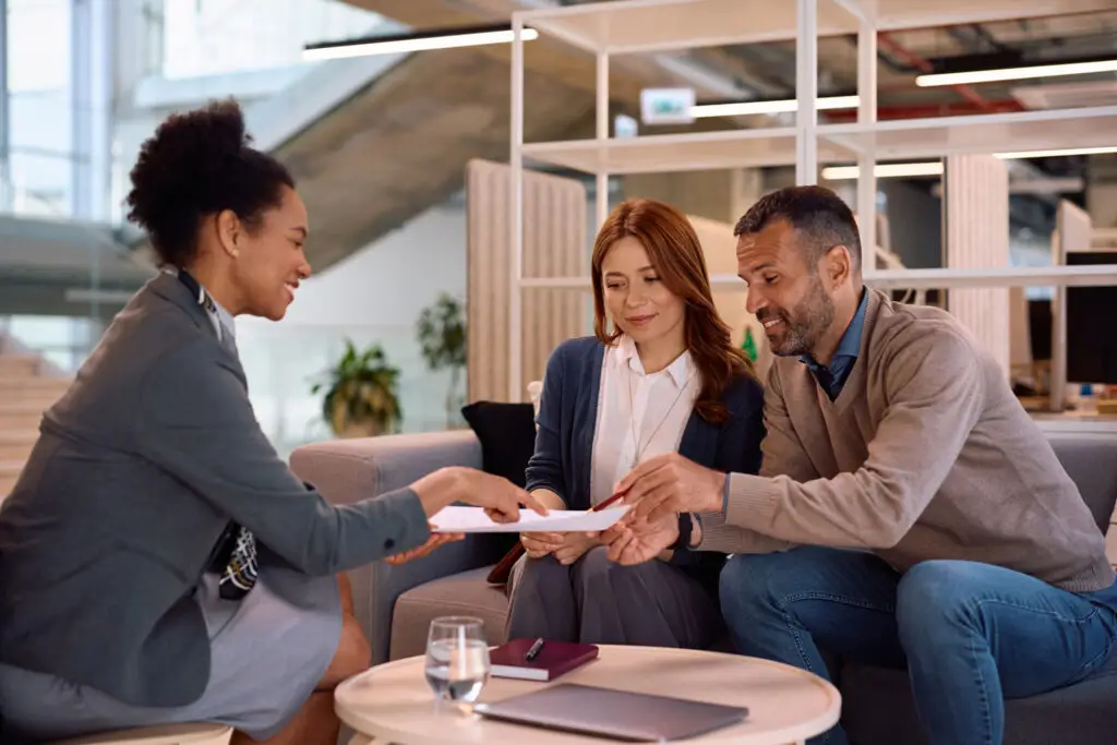 Couple reviewing loan options with a mortgage advisor