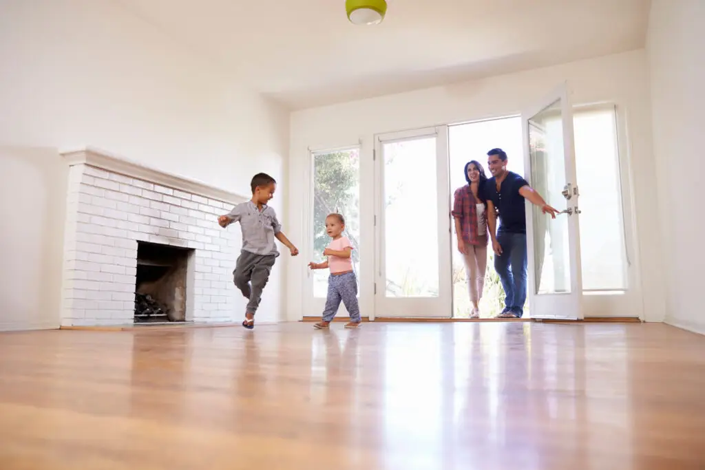 Family walking into their new home for the first time